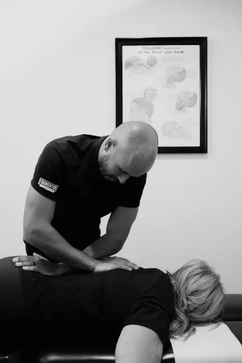 Chiropractor performing diversified full spin chiropractic adjustment