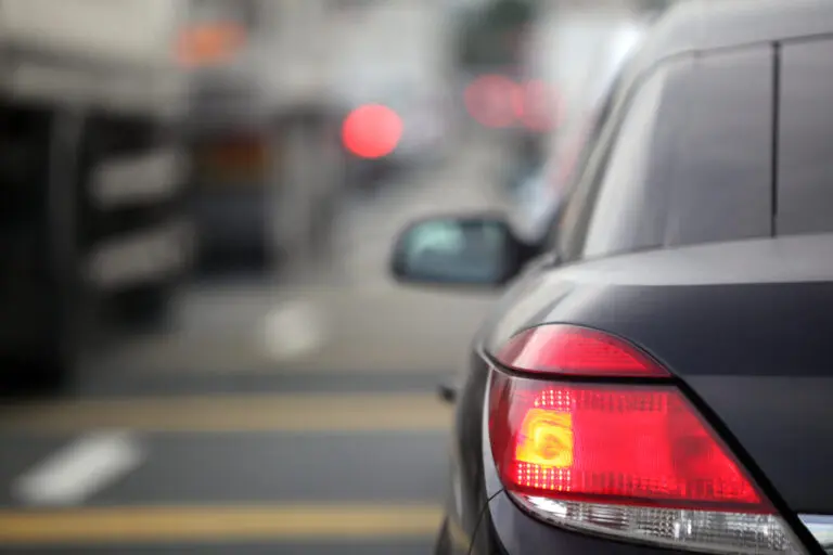 Close-up of a brake light switch component used in vehicles
