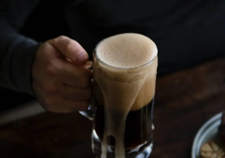 Close-up of a glass of beer on a wooden table