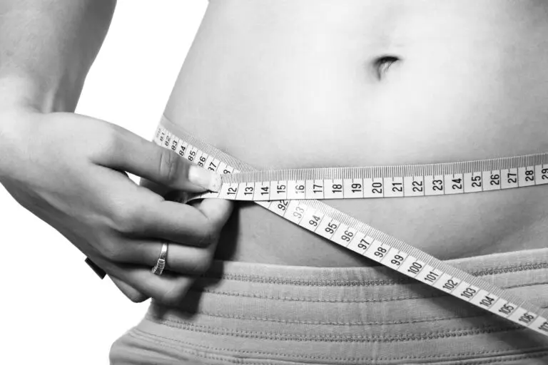 Close-up black and white photo showing a person's belly