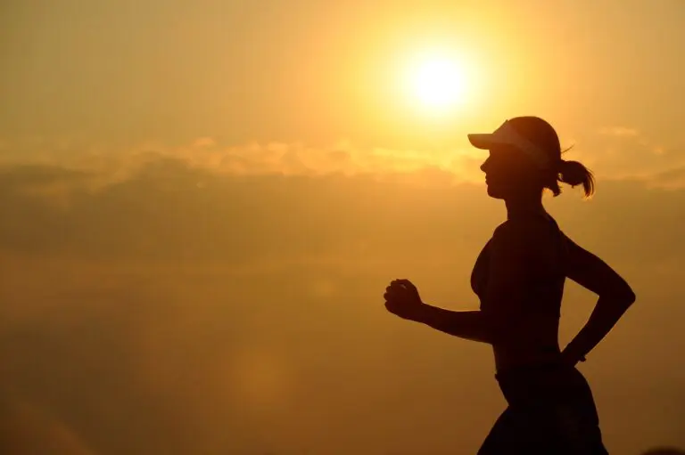 A long distance runner running on a road in fitness training