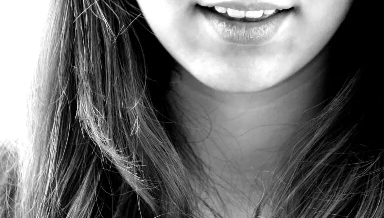Girl smiling and laughing with visible teeth