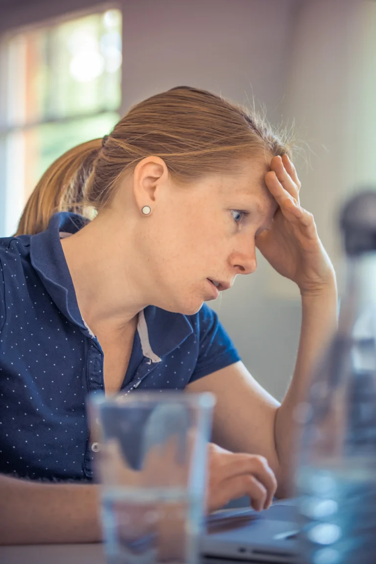 Adult woman showing signs of anxiety from headache discomfort