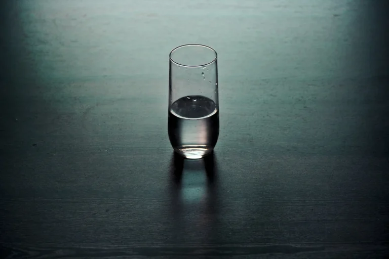 A glass filled halfway with water