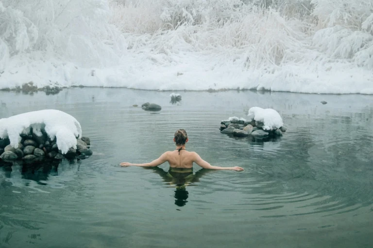 Person immersing in cold plunge bath for health benefits