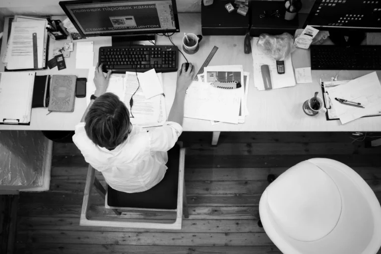 Office desk with ergonomic chair and computer for comfortable workplace posture