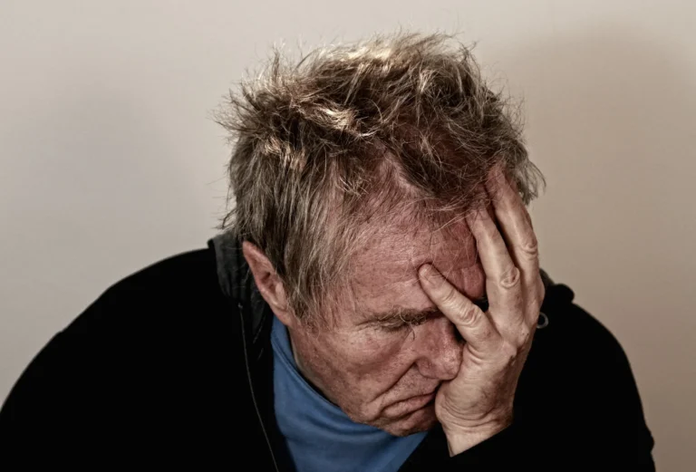 Person relaxing to reduce headache naturally