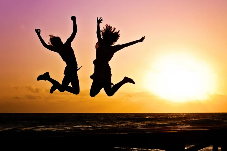 Young person jumping joyfully outdoors in active motion